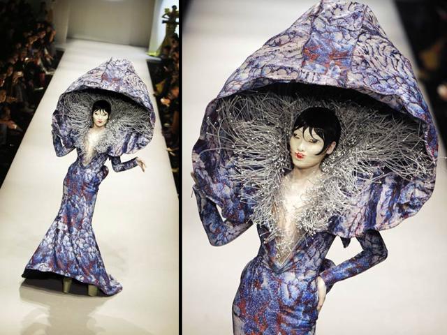 A model presents a creation by Chinese designer Hu Sheguang from HEYUANCIYE Hu Sheguang Collection at the China Fashion Week in Beijing October 31, 2014. (Reuters)