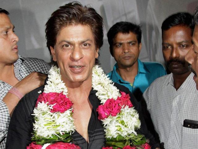 Shah-Rukh-Khan-is-garlanded-by-media-photographers-on-the-eve-of-his--birthday-in-Mumbai-on-Saturday-PTI-Photo