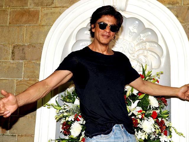 Shah Rukh Khan poses for a photograph during a photocall for his 49th birthday celebrations at his home in Mumbai on November 2, 2014. (AFP)