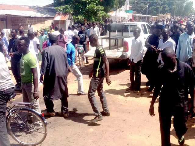 Shiite-faithful-at-the-scene-of-a-suicide-blast-in-the-northeast-Nigerian-town-of-Potiskum-AFP-Photo Shiite-faithful-at-the-scene-of-a-suicide-blast-in-the-northeast-Nigerian-town-of-Potiskum-AFP-Photo