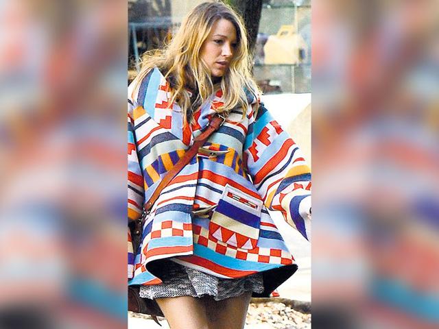 Actor Blake Lively rocks a cheery printed blanket cape. Actor Blake Lively rocks a cheery printed blanket cape.