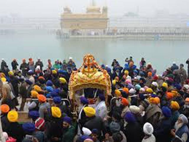 Sikh devotees lead a 'Nagar Kirtan' during a religious procession at Golden Temple in Amritsar. (PTI Photo)