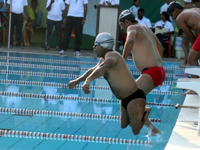 Swimmers make a splash during the 14th National Paralympic Swimming championship in Indore on Friday. (Shankar Mourya/HT photo)