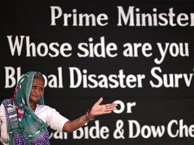 A victim of Bhopal gas tragedy attends a sit-in protest in New Delhi on Monday. Survivors of the tragedy demanded additional compensation for all the affected people. (Reuters photo)