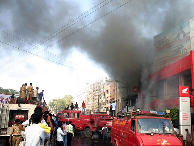Fire broke out at a two-wheeler showroom near Bhopal Talkies in old city area of Bhopal on Monday. (Bidesh Manna/HT photo)