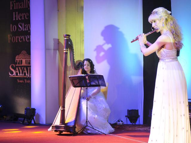Women from Belgium play harp and flute during the inaugural celebration of Sayaji Hotel in Bhopal. (Mujeeb Faruqui/HT photo)