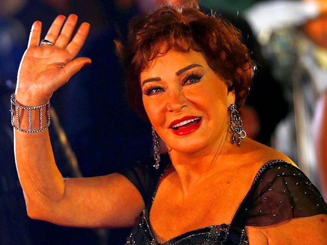 Egyptian actor Lebleba waves on the red carpet during the opening ceremony of the 36th Cairo International Film Festival (CIFF) at the Citadel of Salah El Din in Cairo November 9, 2014. The festival will end on November 18. (Reuters)