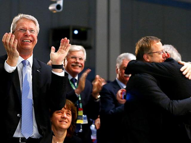 Thomas Reiter, Head of ESOC and ESA Director of Human Spaceflight and Operations, Jean-Jaques Dordain (R) Director General of ESA and German Aerospace Center (DLR) Chairman Johann-Dietrich Woerner (2nd R) react after the successful landing of the Philae lander. (Reuters/Ralph Orlowski)