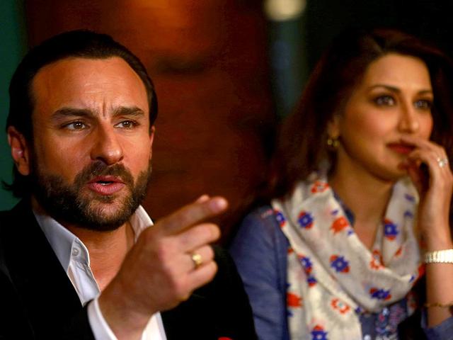 While Saif Ali Khan looks all serious, looks like Sonali Bendre is trying to supress her smile! (AP Photo/Rafiq Maqbool)