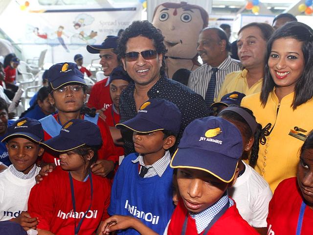 Sachin Tendulkar meets under-privileged and special kids during a event on the eve of Children's day at Santacruz domestic airport in Mumbai. After this, the kids where taken on an airplane ride. (Vidya Subramanian/HT photo)