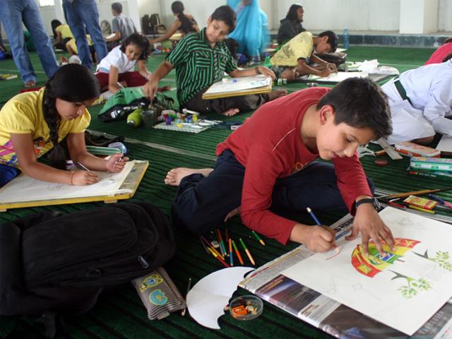 Students of various schools participate in a state-level painting competition on energy conservation, in Bhopal on Saturday. (Bidesh Manna/HT photo)