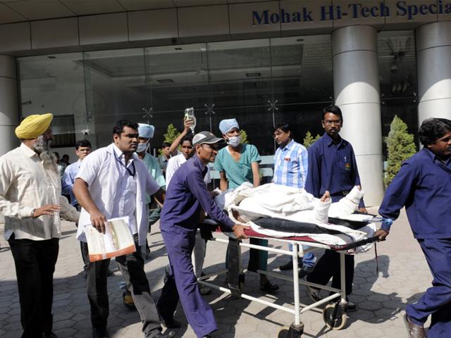 Assistant pilot instructor Capt Pawandeep Singh Pabla, who was injured in the plane crash, being brought to SAIMS hospital in Indore on Wednesday. (Amit K Jaiswal/HT photo)