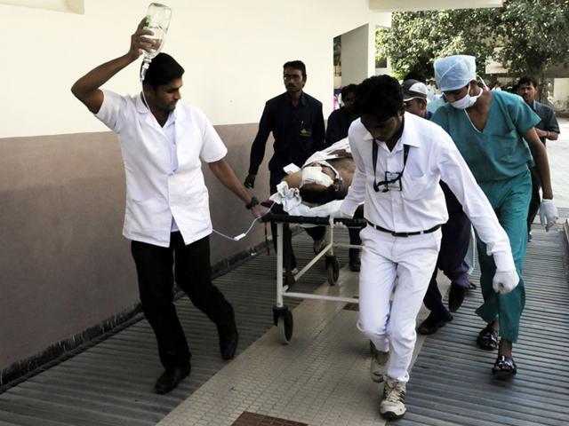 Assistant pilot instructor Capt Pawandeep Singh Pabla, who was injured in the plane crash, being brought to SAIMS hospital in Indore on Wednesday. (Amit K Jaiswal/HT photo)
