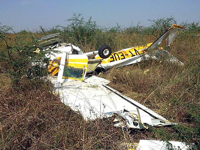 One pilot died and another sustained multiple injuries when a Cessna flight trainer aircraft of MP Flying Club crashed on Indore airport premises on Wednesday. (Arun Mondhe/HT photo)