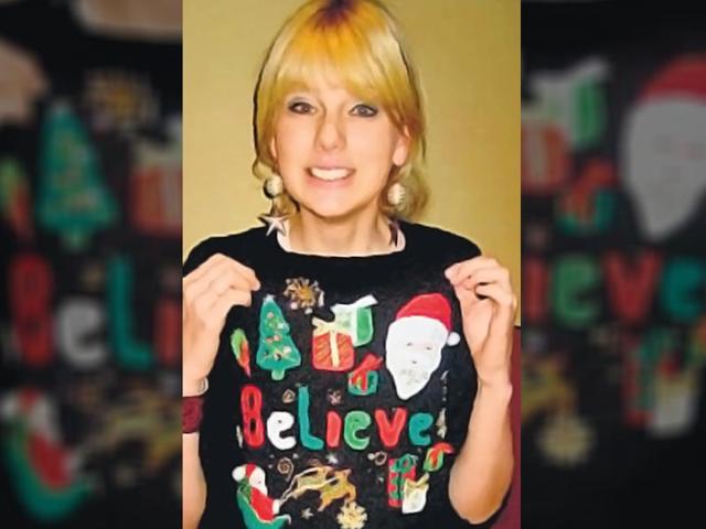 Singer Taylor Swift goes black with her take on the ‘ugly’ sweaters.