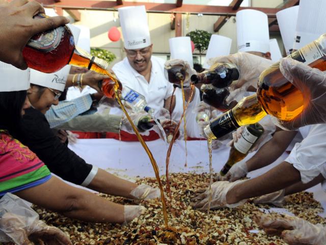 Christmas festivities begin in Indore with a cake mixing ceremony at Radisson Blu Hotel. Roughly 40 kilograms of dry fruits were kept to soak in liquor. (Amit K Jaiswal/HT photo)