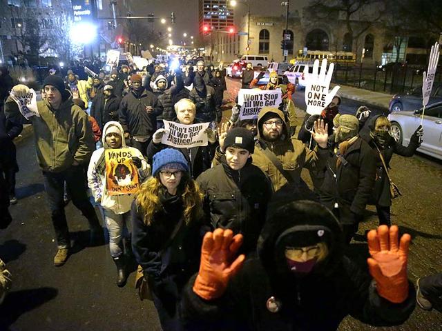 Protesters-march-during-a-rally-near-the-Chicago-Police-headquarters-after-the-announcement-of-the-grand-jury-decision-not-to-indict-Ferguson-police-officer-Darren-Wilson-AP-Photo