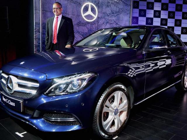 Eberhard-Kern-MD-and-CEO-Mercedes-Benz-India-poses-with-the-new-Edition-C-Class-car-at-its-launch-in-New-Delhi-on-Tuesday-Photo-PTI