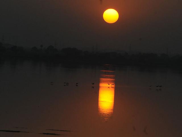 The sunset as seen from Bilawali Lake in Indore on Wednesday. (Arun Mondhe/HT photo)