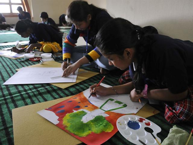 Children take part in a state-level painting competition 'Save a drop, save the future', in Bhopal on Wednesday. (Mujeeb Faruqui/HT photo)