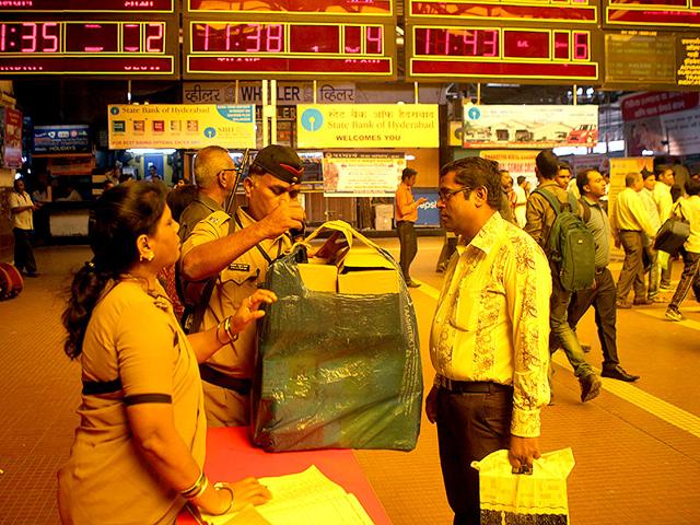 Cops check a baggage at CST railway station in Mumbai. Six years ago, on this day, CST was attacked by gunmen. (Kunal Patil/HT photo)