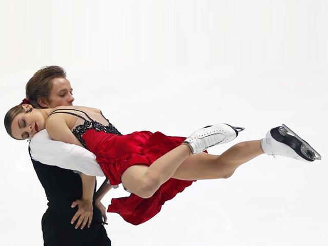 Kaitlin Hawayek and Jean-Luc Baker of the United States perform during the ice dance short program of the NHK Trophy figure skating in Osaka, western Japan. (AP Photo)