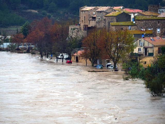 A-photo-shows-the-swollen-river-La-Berre-in-the-flooded-city-of-Portel-des-Corbieres-southern-France-AFP-Photo