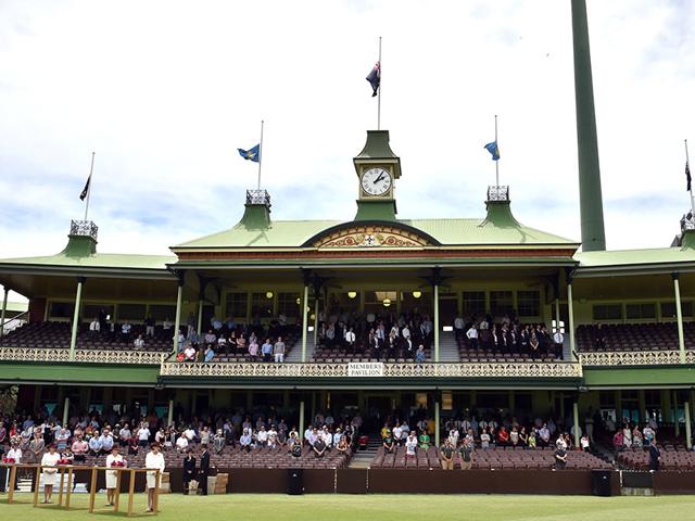 Australia national flags fly half mast as people watch a live broadcast of Australian batsman Phillip Hughes' funeral from his home town Macksville at the Sydney Cricket Ground on Wednesday. (AFP Photo) Australia national flags fly half mast as people watch a live broadcast of Australian batsman Phillip Hughes' funeral from his home town Macksville at the Sydney Cricket Ground on Wednesday. (AFP Photo)
