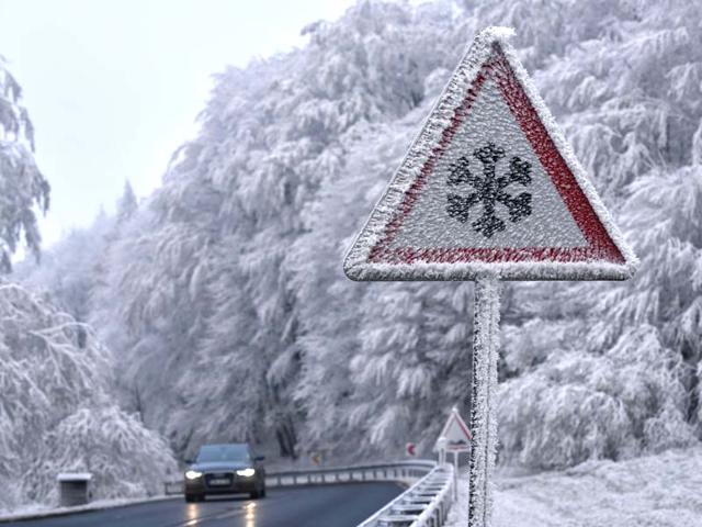 A car drives past an ice and snow warning sign near Hessisch Lichtenau, central Germany. (AFP Photo) A car drives past an ice and snow warning sign near Hessisch Lichtenau, central Germany. (AFP Photo)