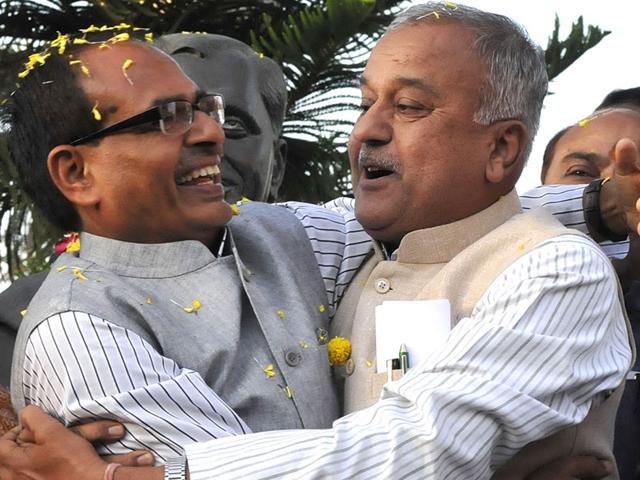 CM Shivraj Singh Chouhan and MP BJP president Nandkumar Singh Chauhan celebrate the party's victory in civic polls, in Bhopal. (Mujeeb Faruqui/HT photo)