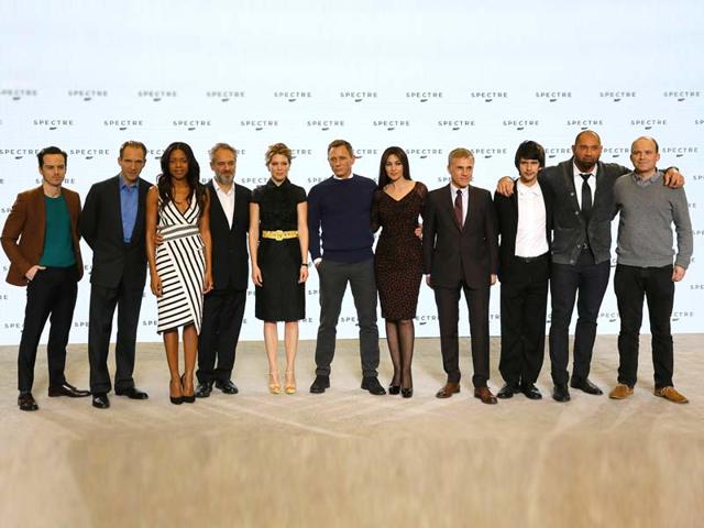 Cast members pose on stage in London. (L-R) Andrew Scott, Ralph Fiennes, Naomie Harris, director Sam Mendes, Lea Seydoux, Daniel Craig, Monica Bellucci, Christopher Waltz, Ben Whishaw, Dave Bautista and Rory Kinnear. (Reuters)