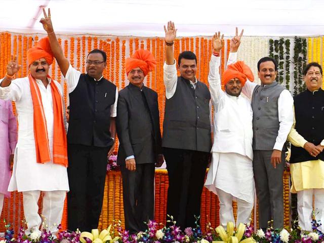 Maharashtra CM Devendra Fadnavis along with Shiv Sena ministers during their swearing-in ceremony in Mumbai. (PTI photo)