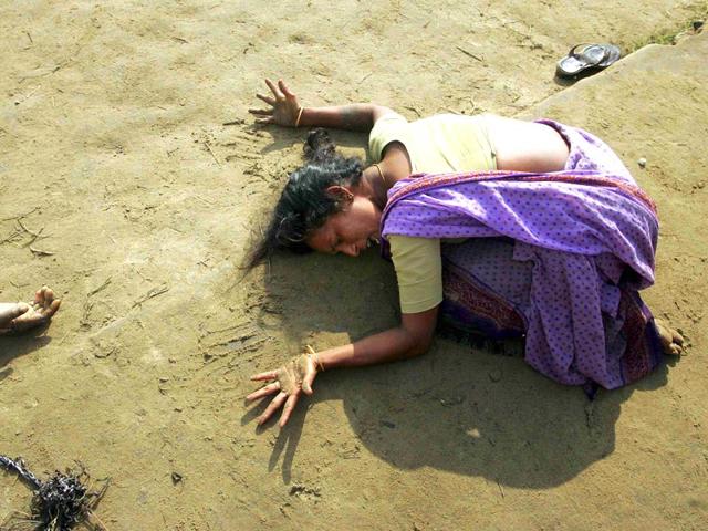 An Indian woman mourns the death of her relative who was killed in the tsunami in Cuddalore, south of Madras, in December 2004. (Reuters)