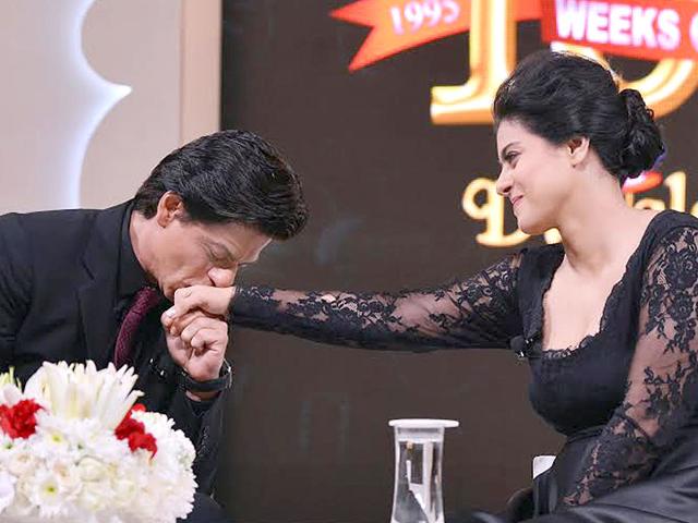Shah Rukh Khan and a graceful kiss on Kajol's hand.