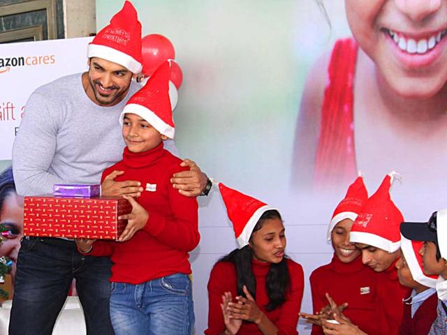 It was an early Christmas for kids in the national capital when Bollywood actor-producer John Abraham turned Santa for the terminally ill and underprivileged children in New Delhi, on Dec 15, 2014. John was seen happily mingling with the kids and presenting gifts to them.(Photo: Amlan Paliwal/IANS)