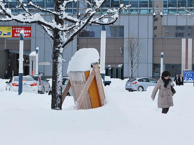 A-woman-walks-on-a-snow-covered-road-in-Obihiro-in-Japan-s-northern-island-of-Hokkaido-AFP-Photo A-woman-walks-on-a-snow-covered-road-in-Obihiro-in-Japan-s-northern-island-of-Hokkaido-AFP-Photo
