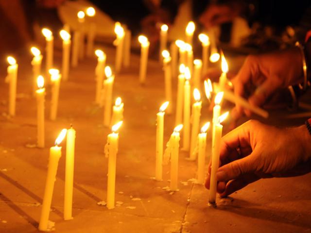 People lit candles in Indore on Wednesday to show solidarity with the victims of Peshawar school attack. (Amit K Jaiswal/HT photo)