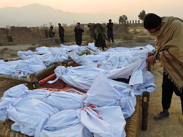 A-Pakistani-Frontier-Corps-member-looks-at-gathered-bodies-of-militants-who-were-killed-in-a-military-operation-in-Tirah-near-the-Pakistan-Afghanistan-border-AFP-PHOTO