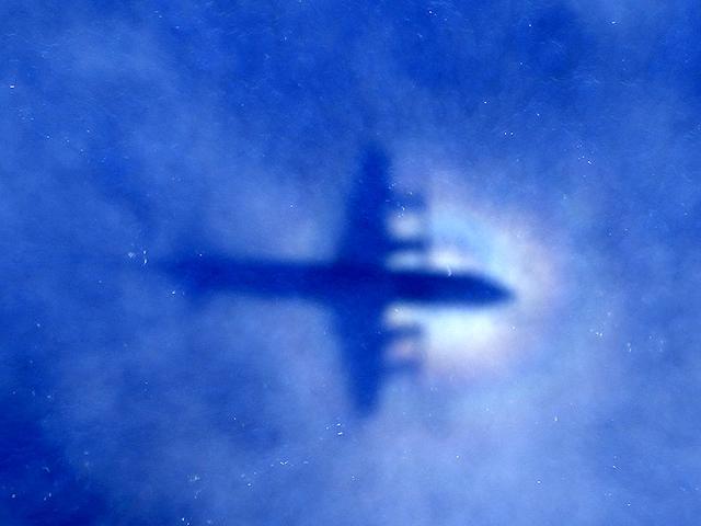 The shadow of a Royal New Zealand Air Force (RNZAF) P3 Orion maritime search aircraft is seen on low-level clouds as it flies over the southern Indian Ocean looking for missing Malaysian Airlines flight MH370. (Reuters Photo)