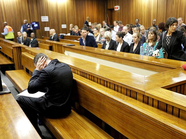 Olympic and Paralympic track star Oscar Pistorius sits in the dock ahead of the second day of his trial for the murder of his girlfriend Reeva Steenkamp at North Gauteng High Court in Pretoria. (Reuters Photo)