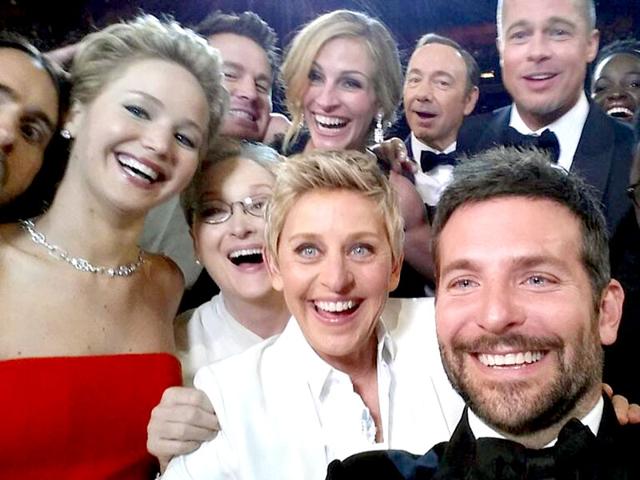 This image released by Ellen DeGeneres shows actors front row from left, Jared Leto, Jennifer Lawrence, Meryl Streep, Ellen DeGeneres, Bradley Cooper, Peter Nyong'o Jr., and, second row, from left, Channing Tatum, Julia Roberts, Kevin Spacey, Brad Pitt, Lupita Nyong'o and Angelina Jolie as they pose for a "selfie" portrait on a cell phone during the Oscars at the Dolby Theatre. (AP Photo/Ellen DeGeneres, File)