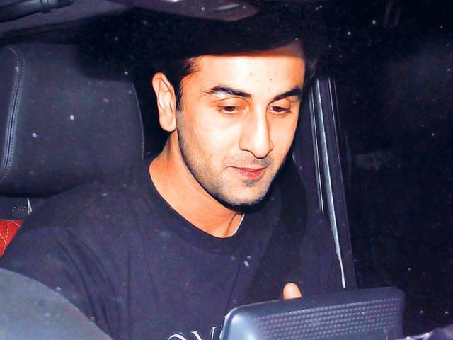 Ranbir Kapoor tries his best to avoid the shutterbugs. (Photos: Yogen Shah)