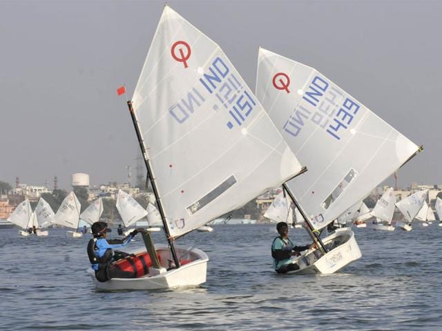 Sailors compete in the National Inland Optimist Sailing Championship 2014, in Bhopal on Saturday. Nearly 50 teams from all over India are taking part in the event. (Mujeeb Faruqui/HT photo)