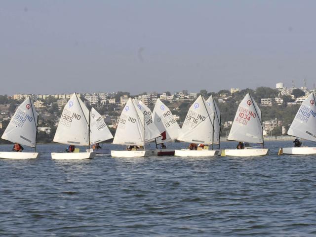 Sailors compete in the National Inland Optimist Sailing Championship 2014, at Upper lake in Bhopal, on Saturday. (Mujeeb Faruqui/HT photo)