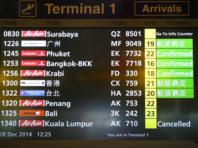 A flight information signboard shows the status of AirAsia flight QZ 8501 from the Indonesian city of Surabaya to Singapore at Changi Airport in Singapore. (Reuters)