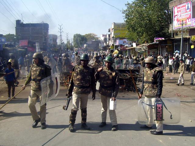 Policemen deployed in Gairatganj town of Raisen district after communal violence on Monday. (HT photo)