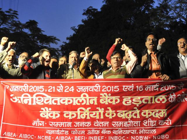 Bank employees stage a demonstration ahead of their nationwide strike to demand wage revision, in Bhopal on Tuesday. (Mujeeb Faruqui/HT photo)