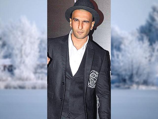 Rockstar-This-is-the-perfect-look-for-an-evening-party-Actor-Ranveer-Singh-wears-a-three-piece-black-suit-with-a-crisp-white-shirt-Always-go-for-a-contrasting-shirt-if-you-re-wearing-same-hue-suit-Add-an-edge-to-your-look-by-accessorising-with-a-hat-scarf-or-pocket-square