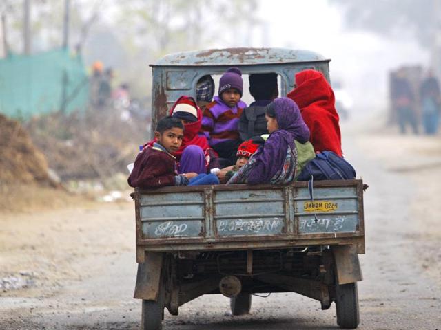Villagers sit in a vehicle as they flee their homes fearing firing from the Pakistan side, in Samba sector. (AP Photo) Villagers sit in a vehicle as they flee their homes fearing firing from the Pakistan side, in Samba sector. (AP Photo)