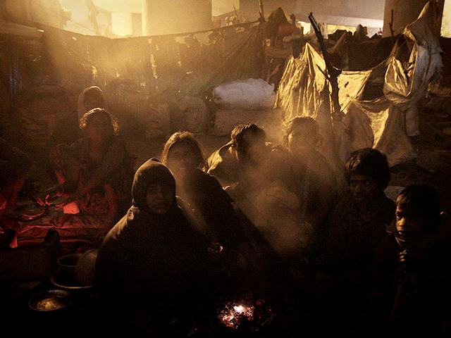 More than a lakh are out on the streets of Delhi alone. They are homeless, hungry and cold. And they are not just winter statistics. HT photographer Subrata Biswas documents their lives in the Indian capital. Children huddle around a coal fire in a make-shift home under the Modi Mill flyover near Okhla station. (Text by Furquan Ameen Siddiqui)